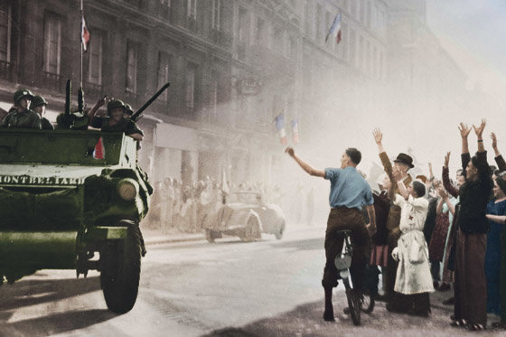 FRANCE - CIRCA 1944:  World War II. Liberation of Paris. The armoured cars of Leclerc's division arriving rue Guynemer, August 25, 1944. Colourized picture.  (Photo by ND/Roger Viollet/Getty Images)